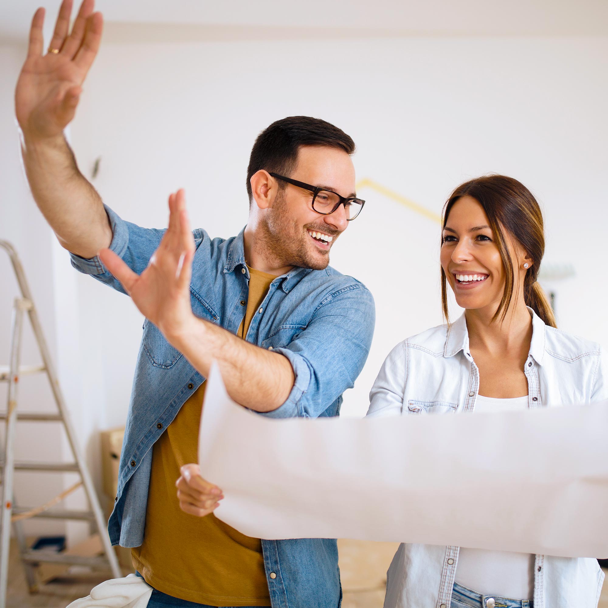 A daughter dances with her mom in the kitchen.