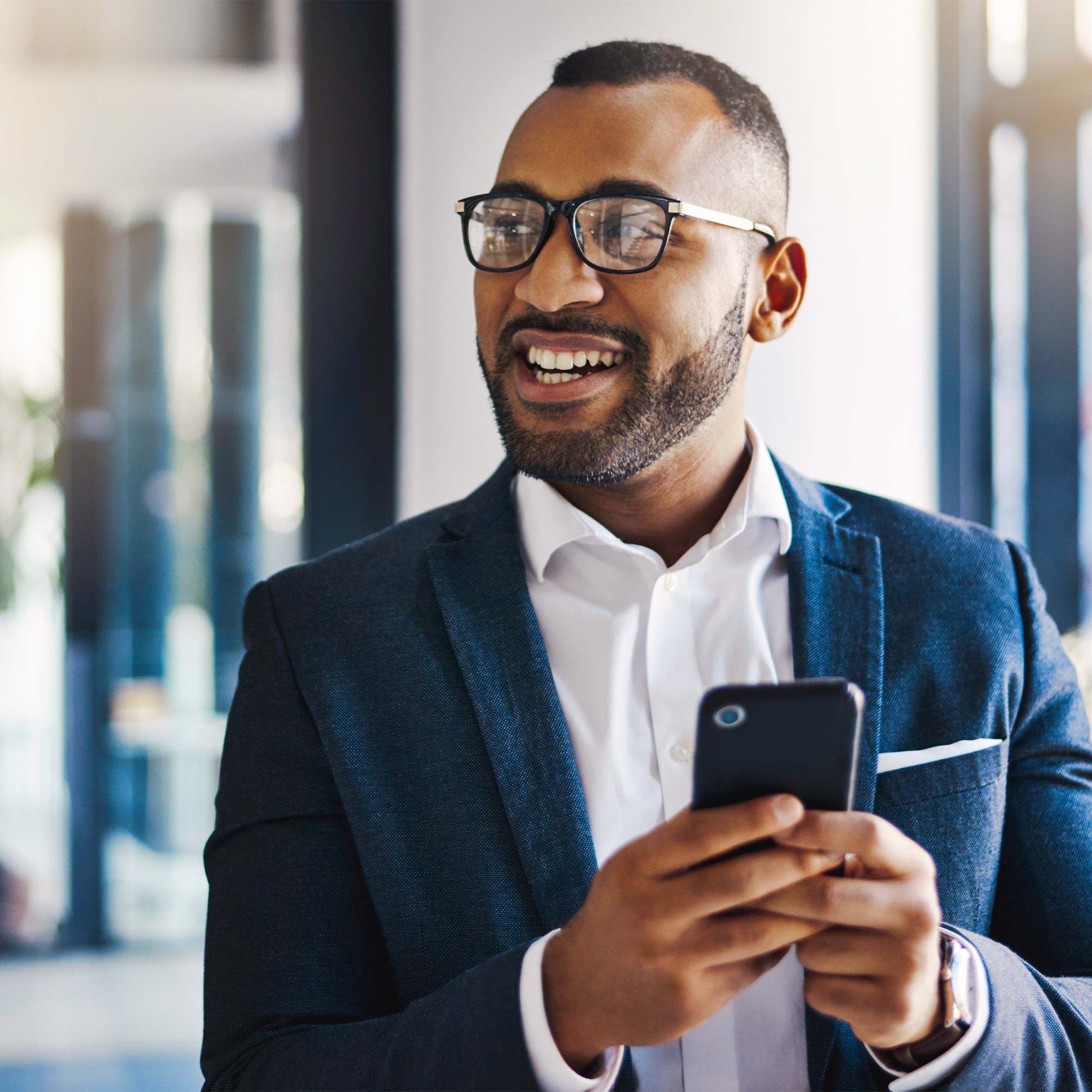 A professionally dressed man and woman wearing gray suits walk and talk.