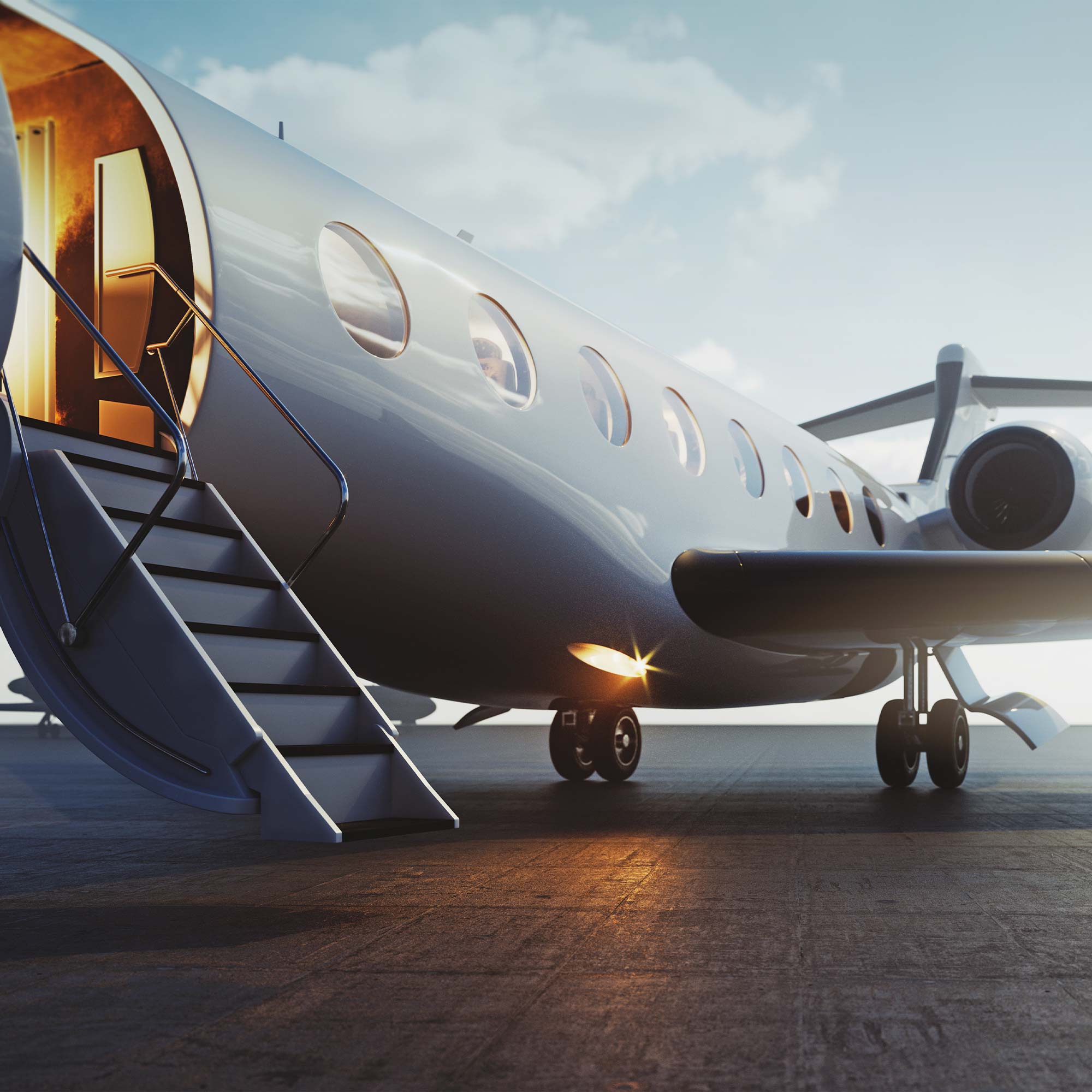 A commercial airplane sits on a runway at sunset.