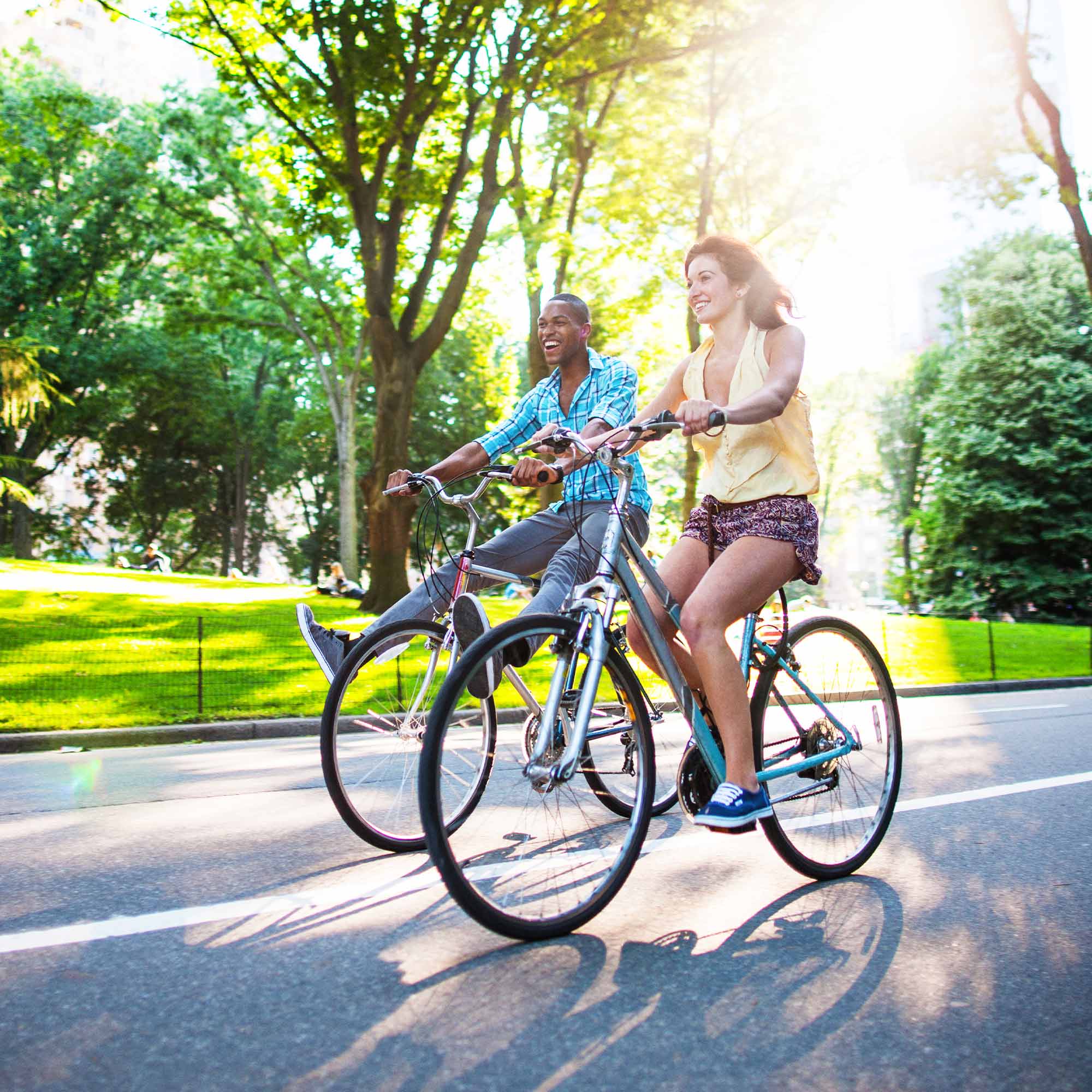 man and woman riding bicycles