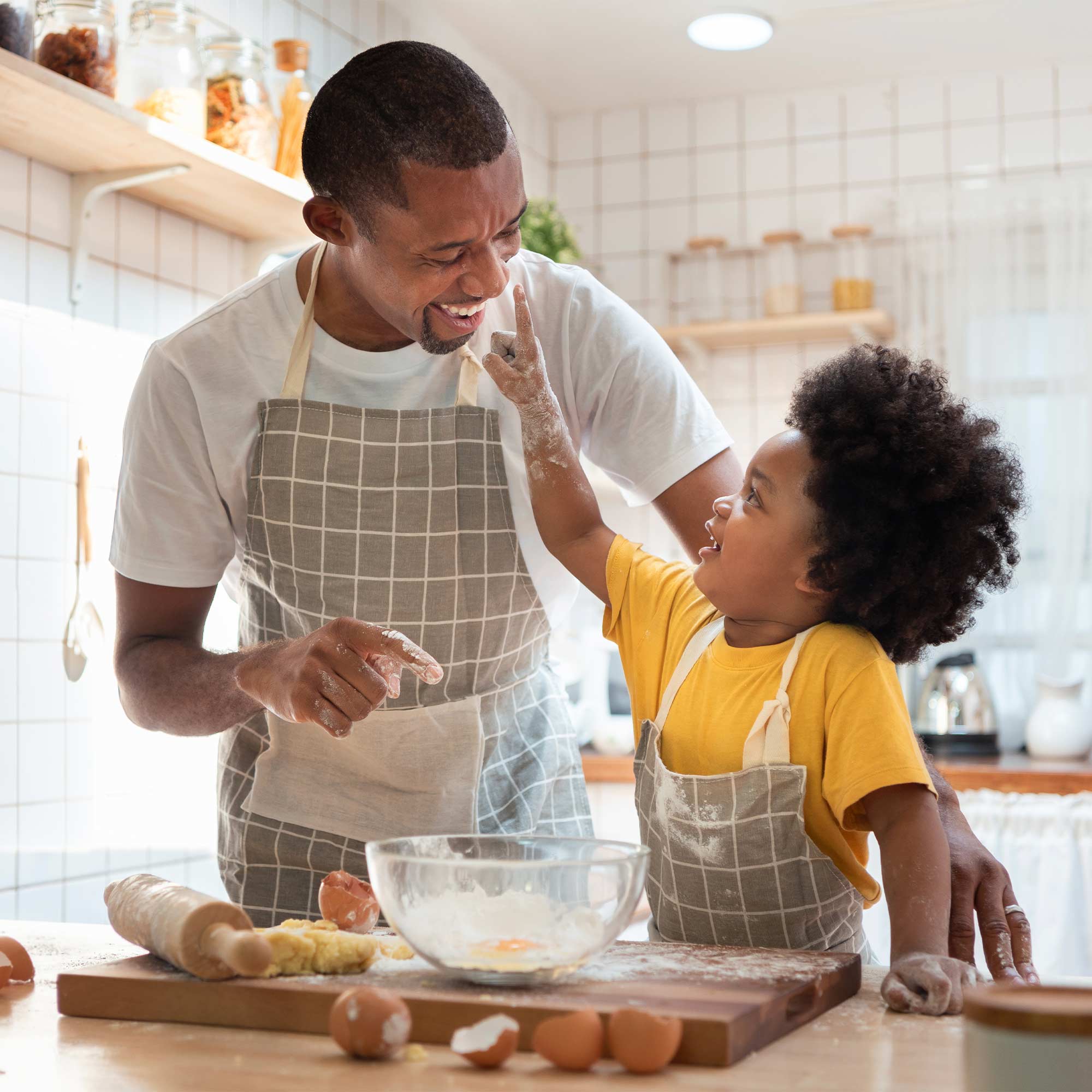 A flower shop attendant helps a woman checkout with contactless payment.