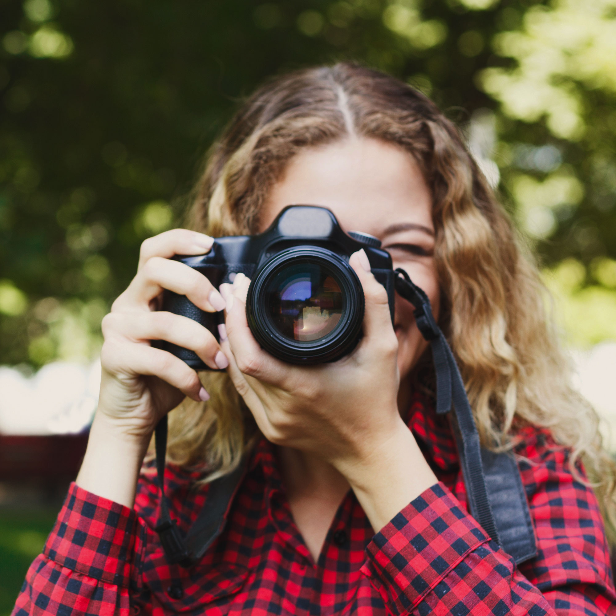Woman taking a professional photograph