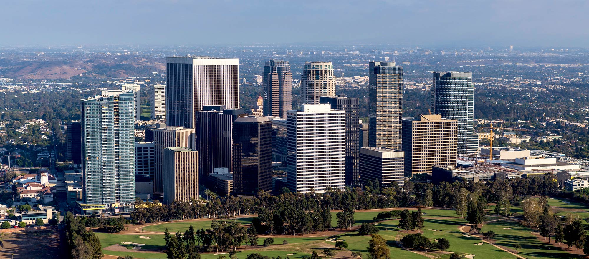 a city with tall buildings and trees