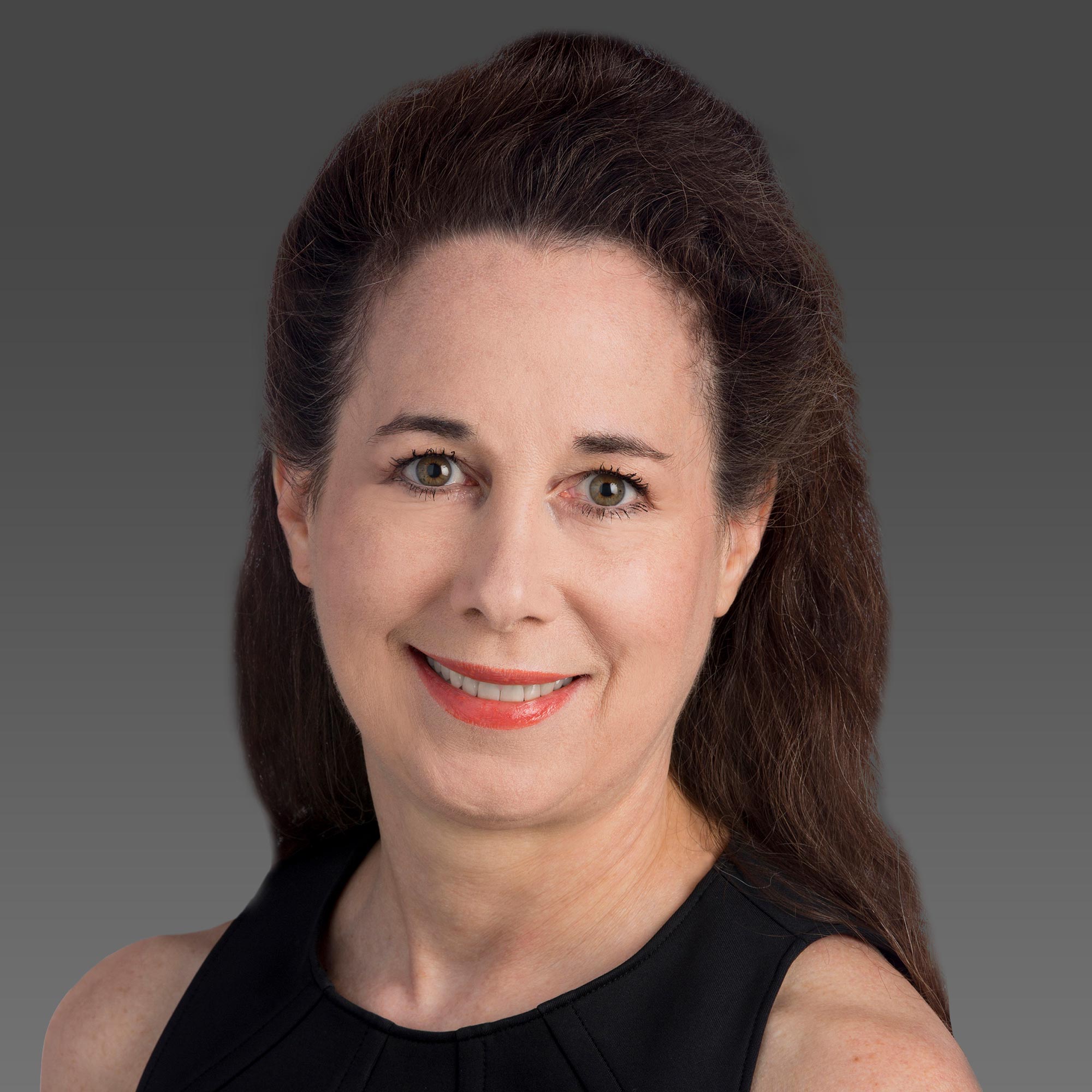 a woman with long brown hair wearing a black dress