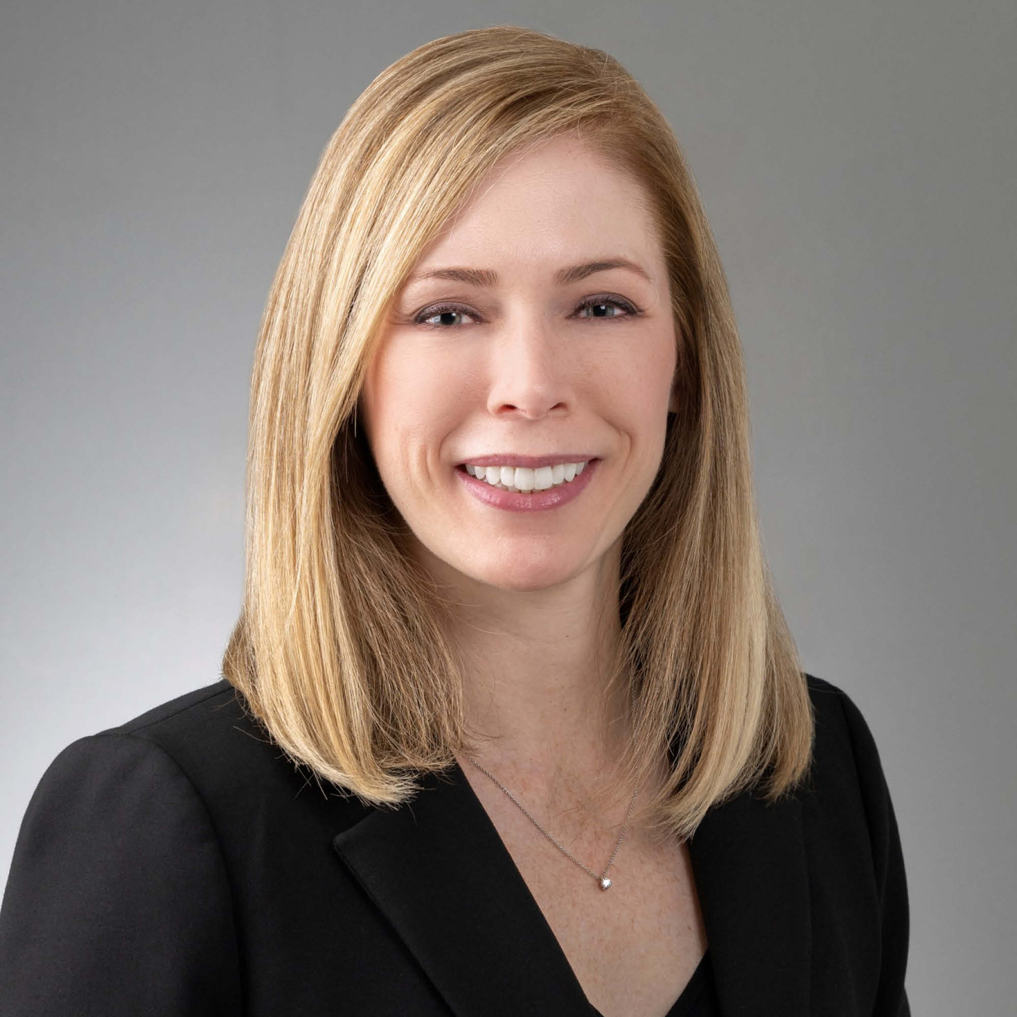 a woman in a black suit