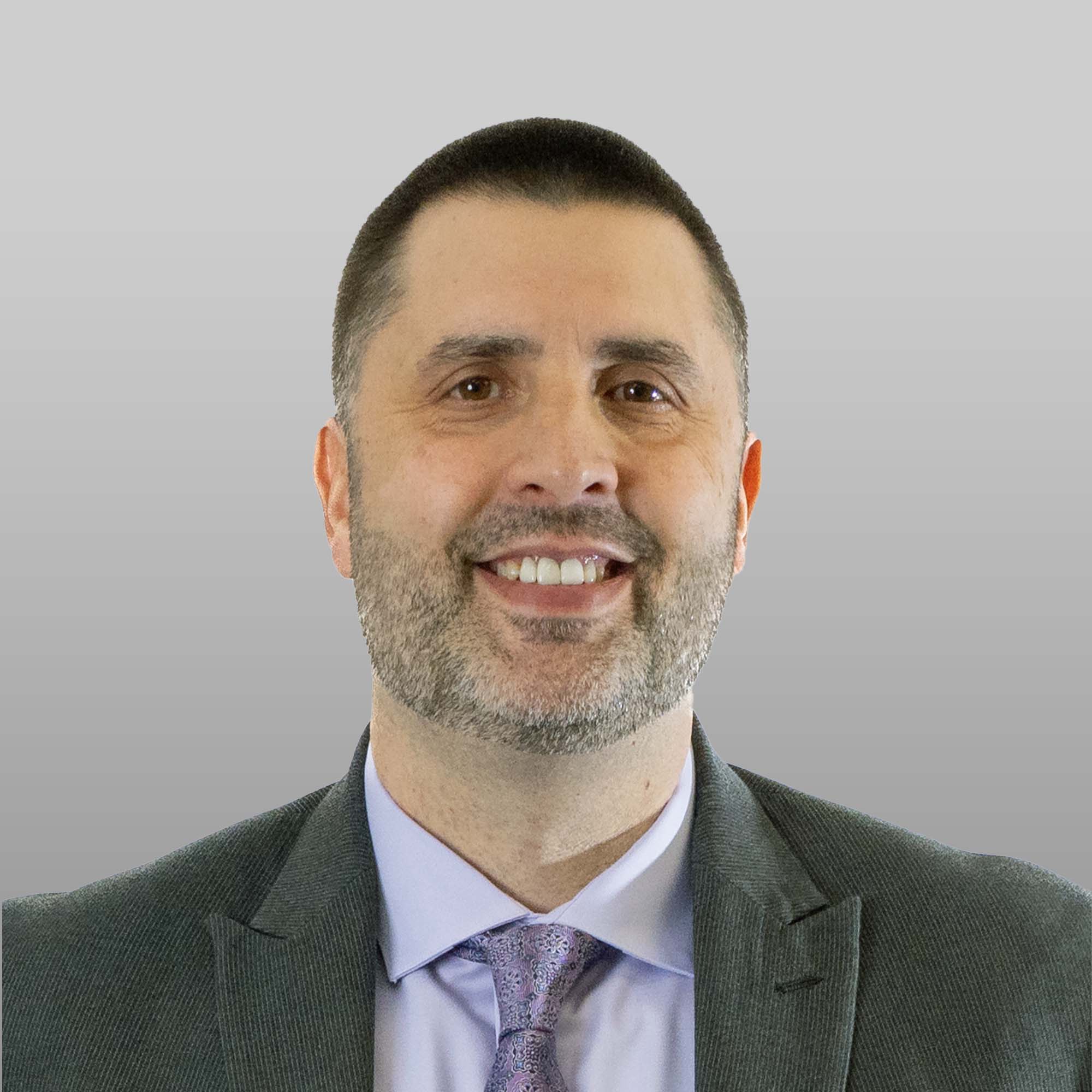 a man in a suit smiling
