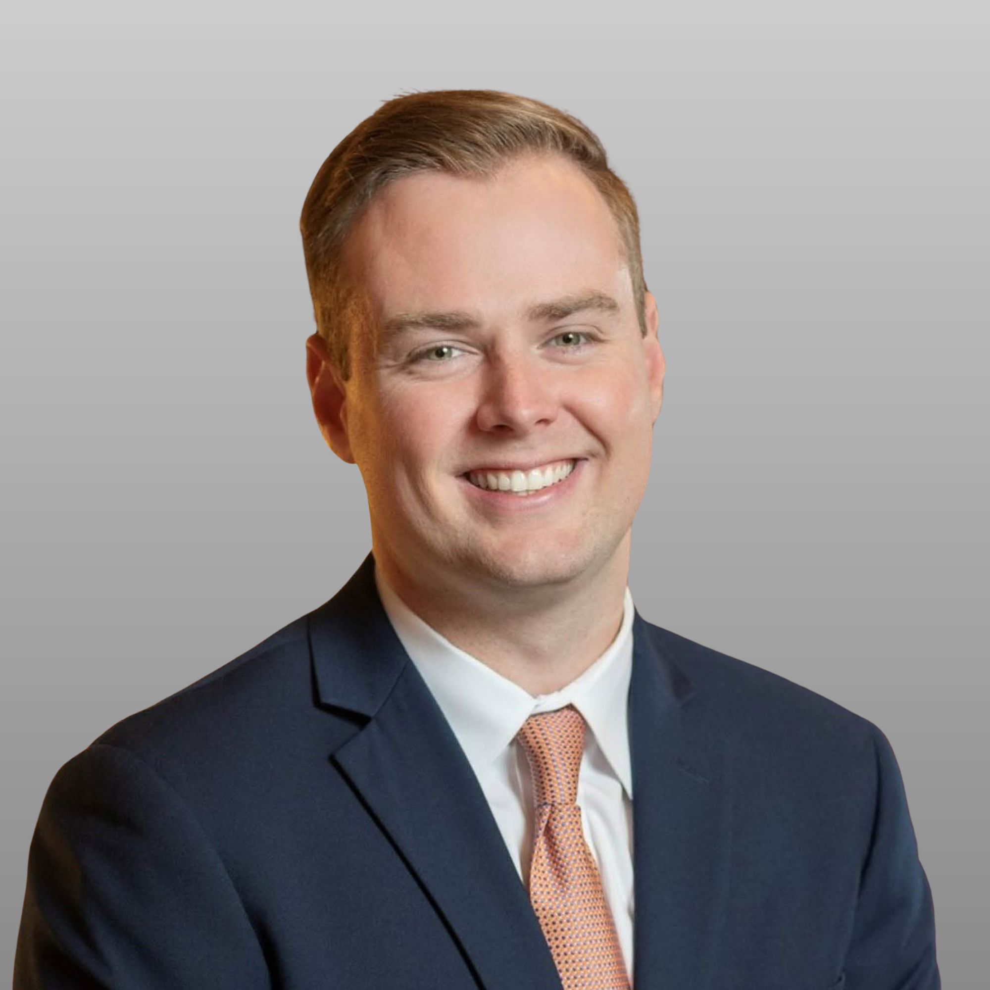 a man in a suit smiling