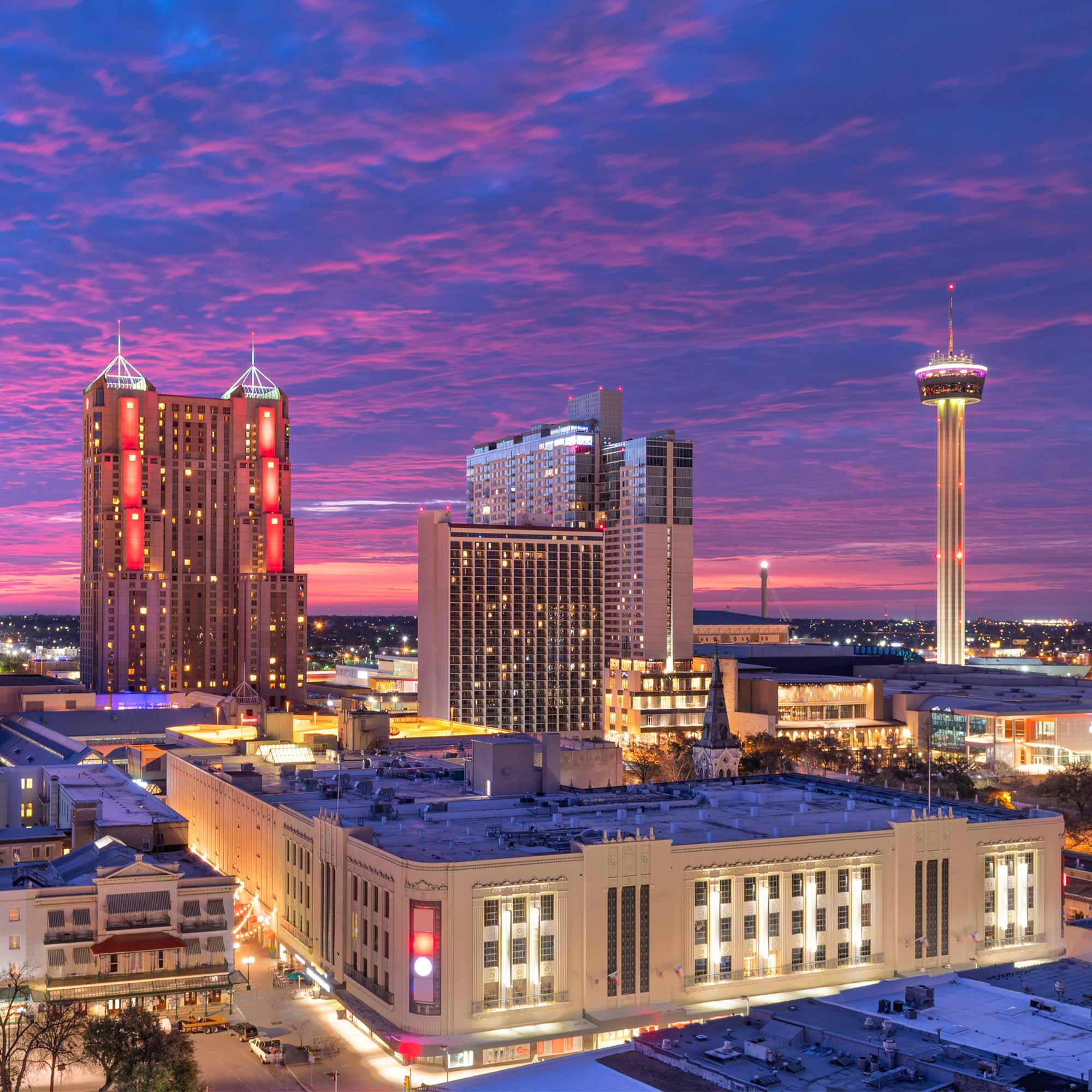 a city skyline with a tower and buildings