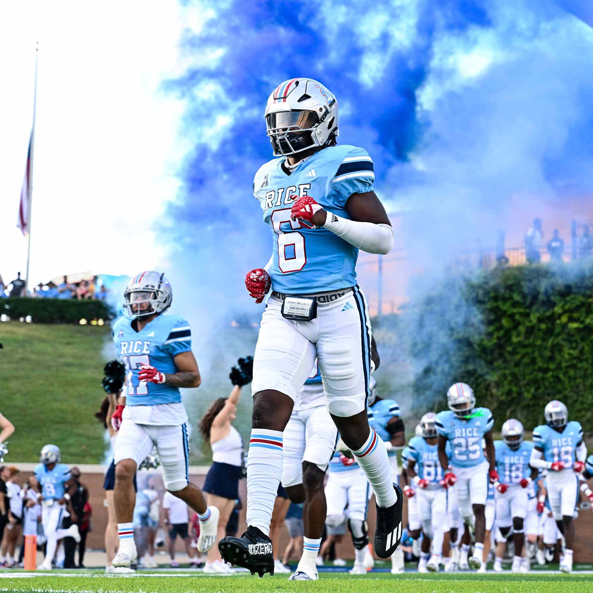 a football player running with smoke coming out of his mouth