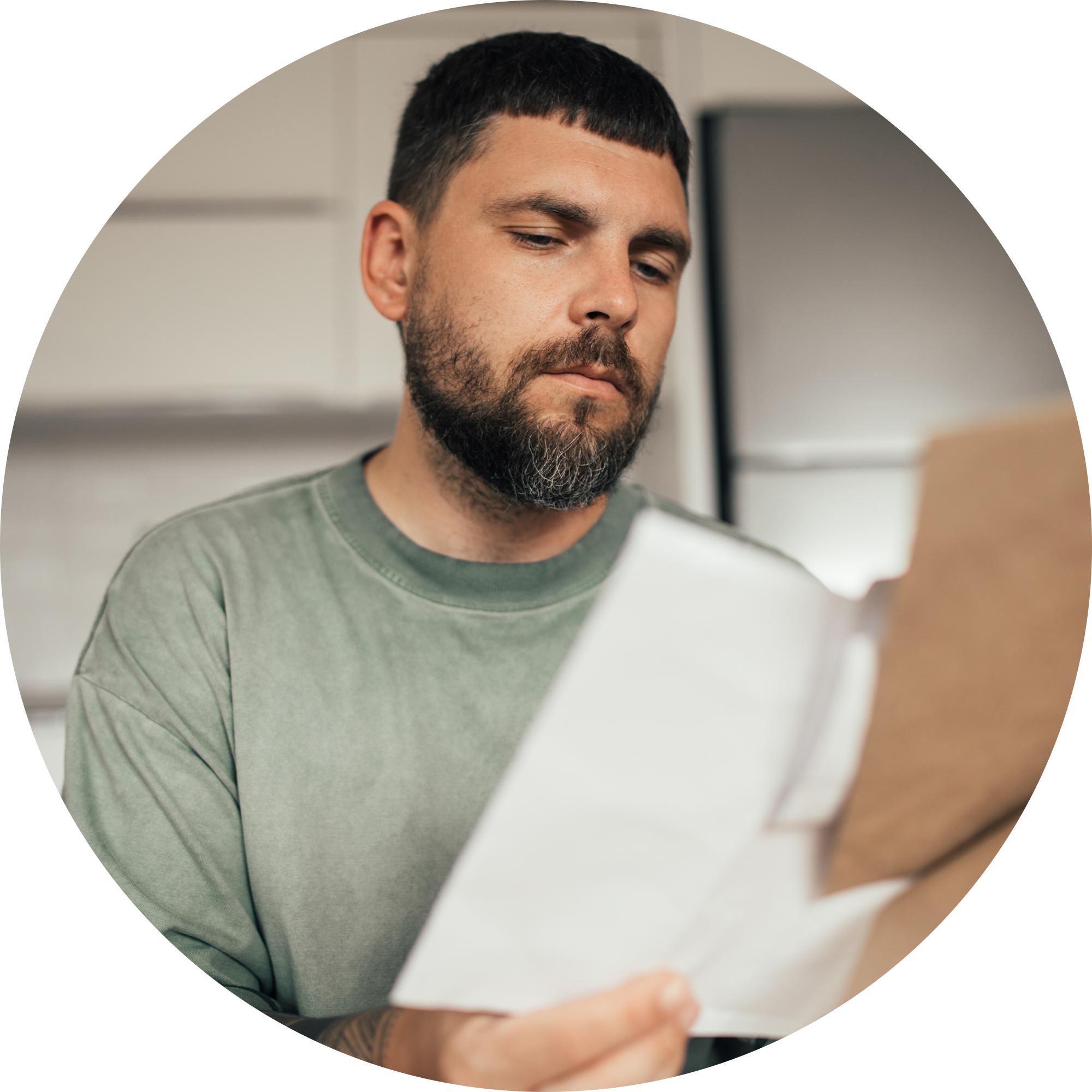 Man looking and shuffling through papers.