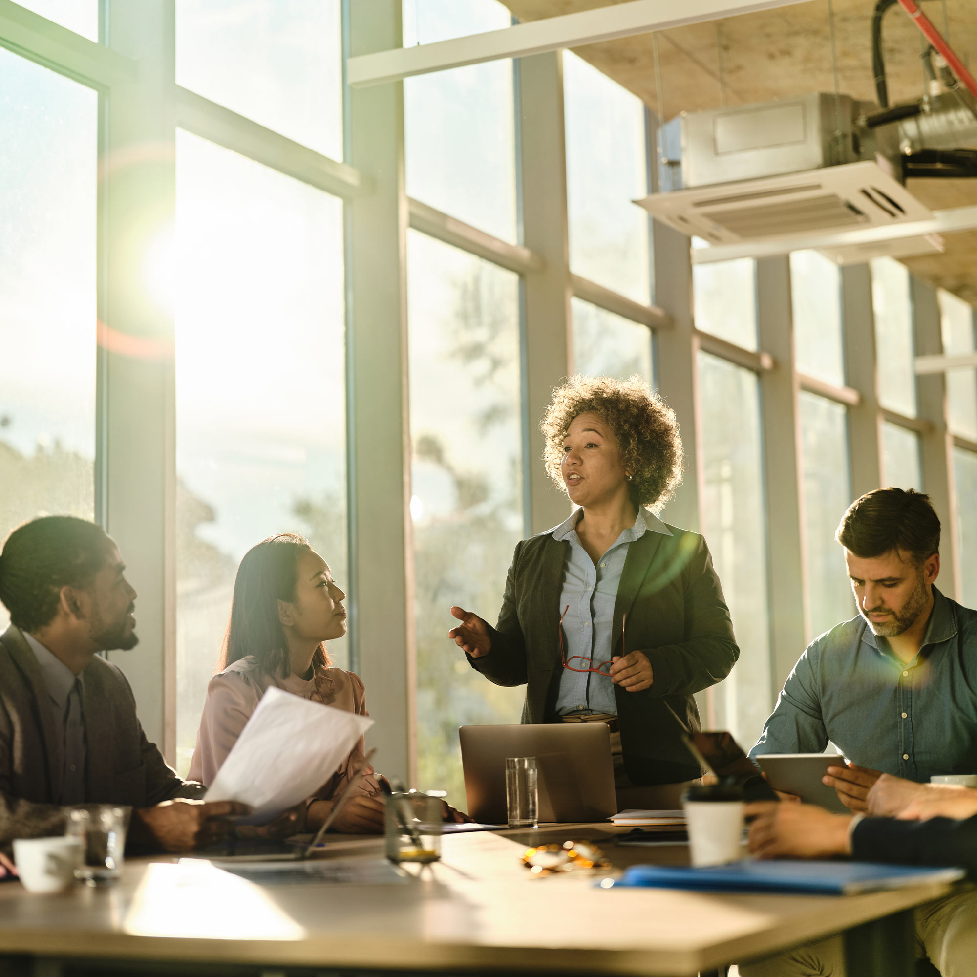 a group of people sitting around a table