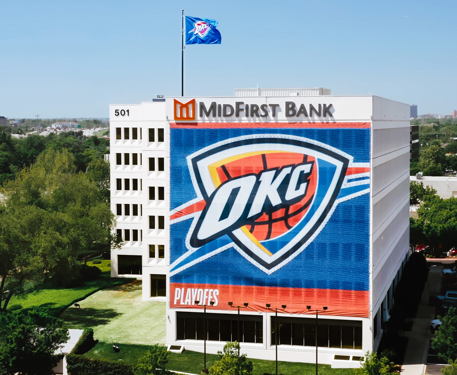 MidFirst Bank corporate location with an OKC Thunder Banner hanging on the side of the building