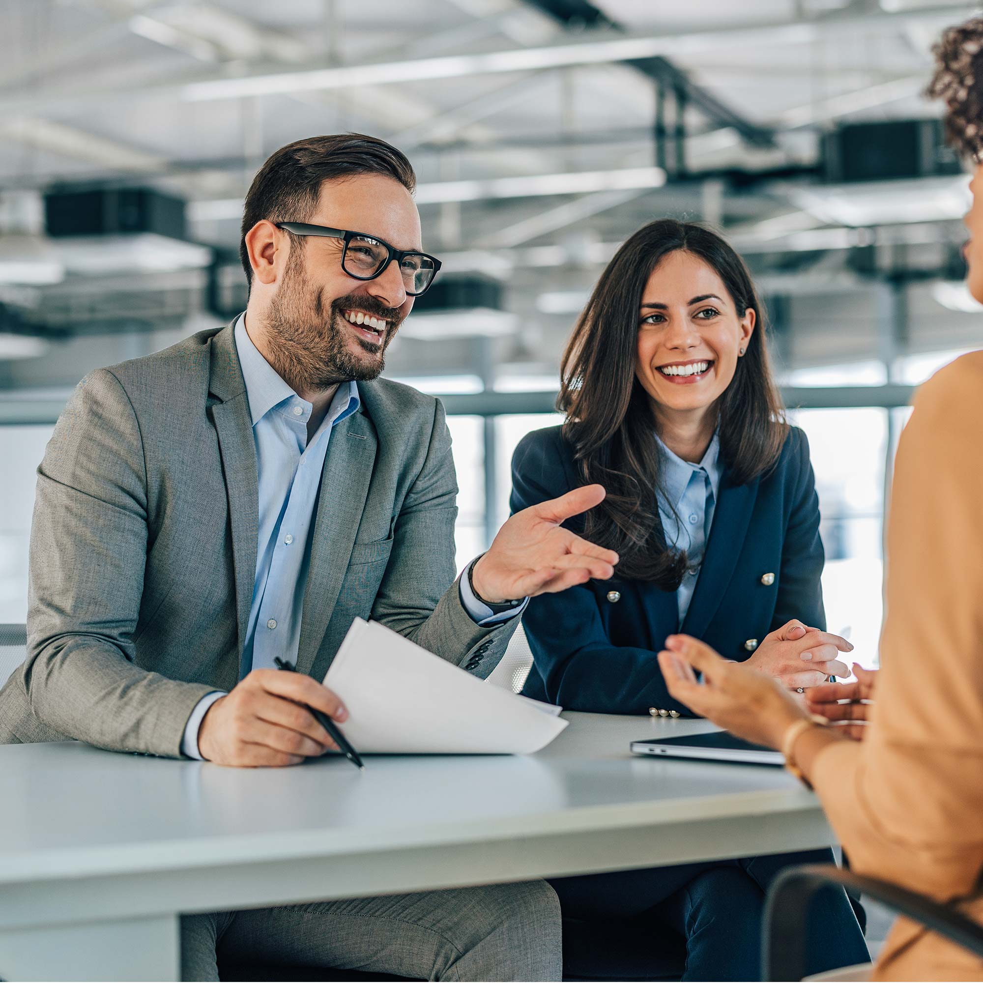 Man and woman in office smiling