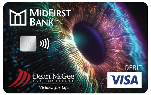 A MidFirst debit card featuring a closeup image of an eye and the Dean McGee Eye Institute logo
