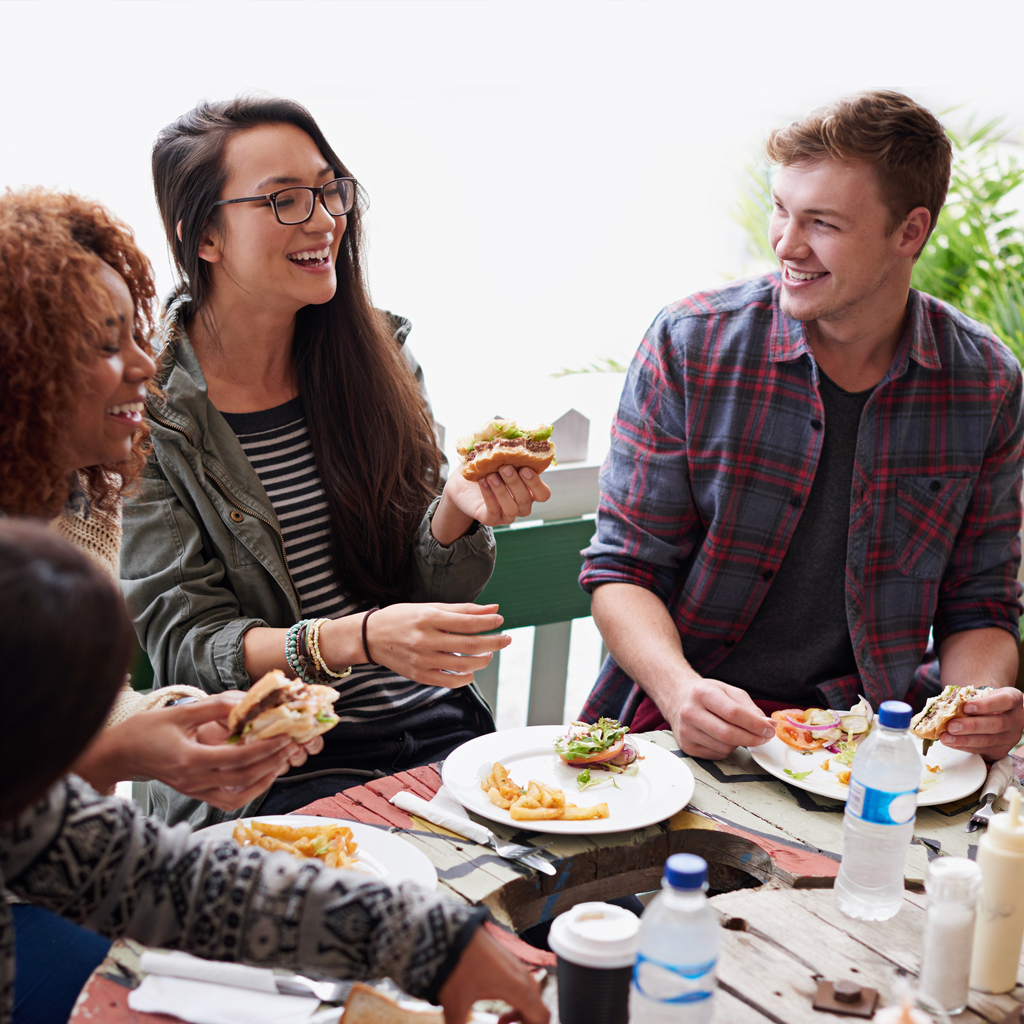 Three students enjoy a meal together