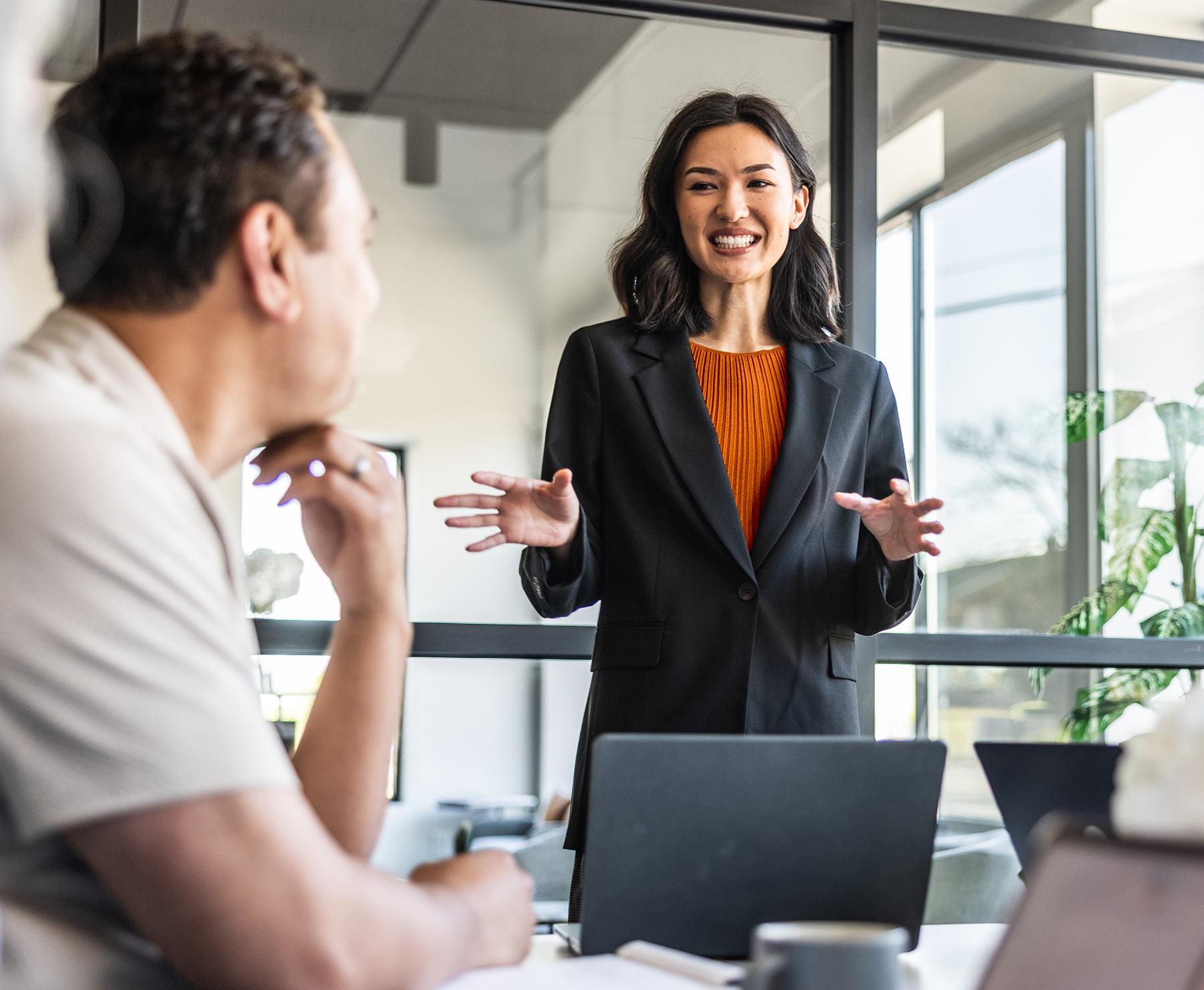 A family of four walk on the beach.